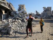 Israel continues to pound Gaza, issue new evacuation threats