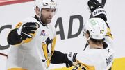 Bryan Rust has hat trick as Penguins score 6 in 3rd period and rout Canadiens 9-2