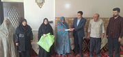 تکریم بانوی سالمند ناشنوا در روستای هفت چشمه شهرستان آذرشهر
