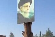 » پاره کردن بنرهای خامنه ای در حلب