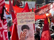 تلفیق شعارهای سیاسی با باورهای مذهبی در مراسم تشییع قائد شهید امت
