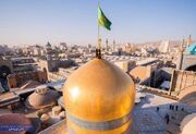 تعویض پرچم گنبد و پوش ضریح مطهر امام رضا(ع)