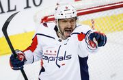 Capitals close trip with win over Flames, move back into playoff spot